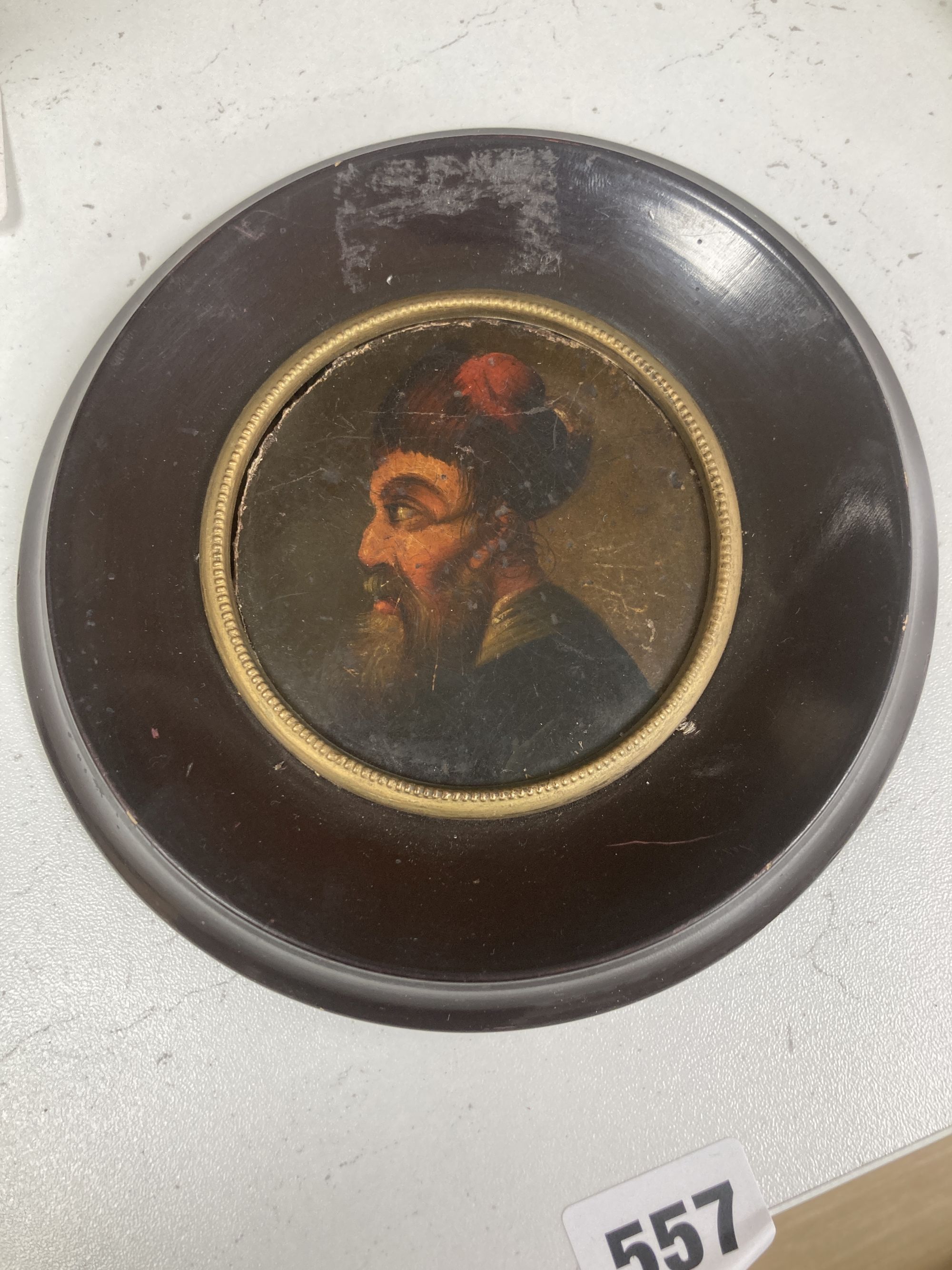 19th century Continental School (Stobwasser), oil on papier mache, Portrait of Turk, probably once a snuff box lid, tondo, 8cm